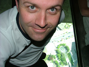 Me sitting on the glass floor of the CN Tower