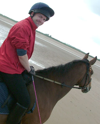 Me riding Jemma on the beach